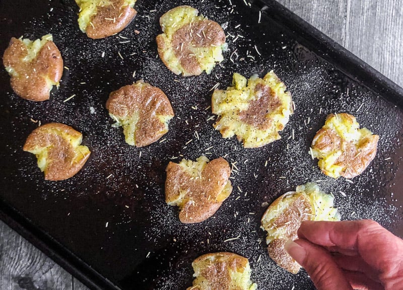 Adding rosemary to the smash potatoes